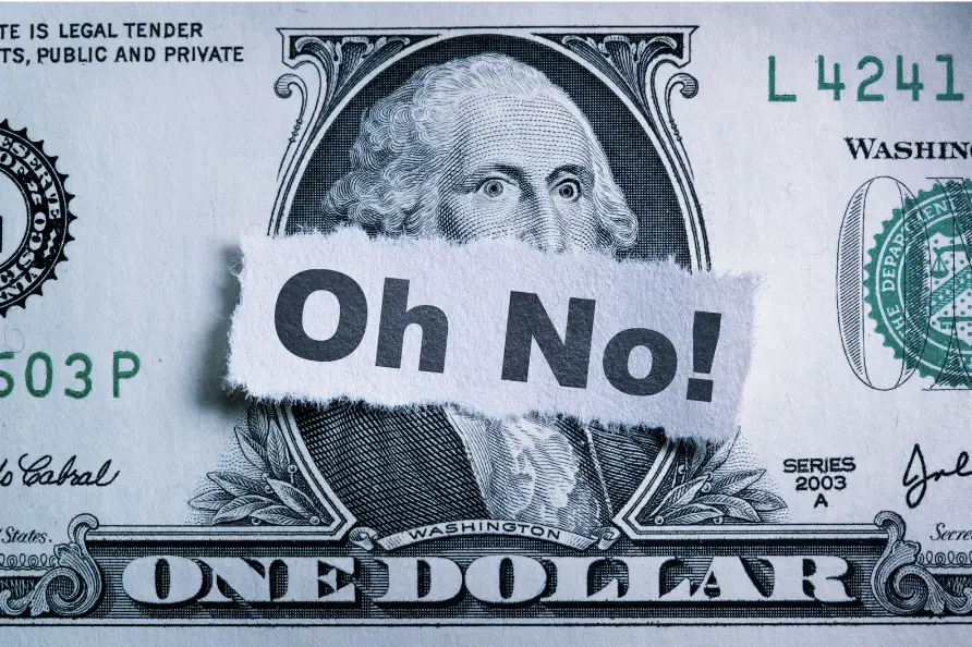 Dollar bill with the word 'oh no' on it - demonstrating the mistakes people make when filing taxes